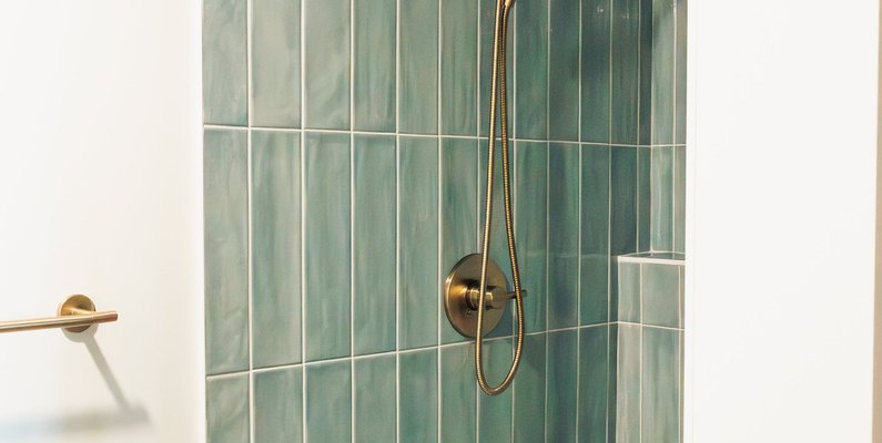 12. Small but Mighty: A Clever Under-Stair Shower in This Colorado Basement Remodel — Reither Construction
